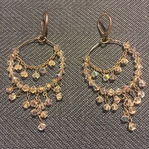 Silver hoop earrings with white dangling beads